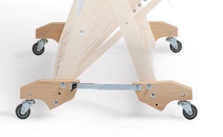 The 4 Wolf Loom Stroller wheels, on a folded loom, so the wheels are engaged and ready to roll.