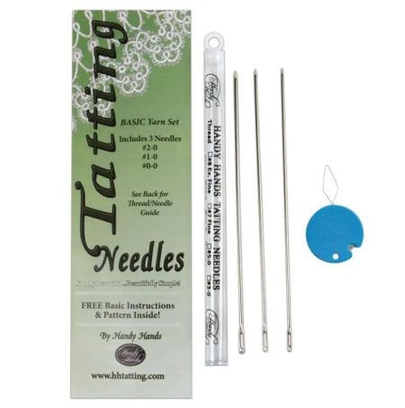 The Tatting Needle Yarn set package, with the 3 needles, plastic storage tube and threader laid out beside it.