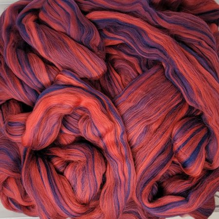 A ball of Carnelian Wool Spinning Fiber.