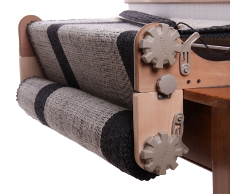 Freedom roller shown on the loom, with a warp