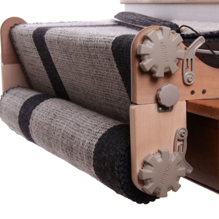 Freedom roller shown on the loom, with a warp